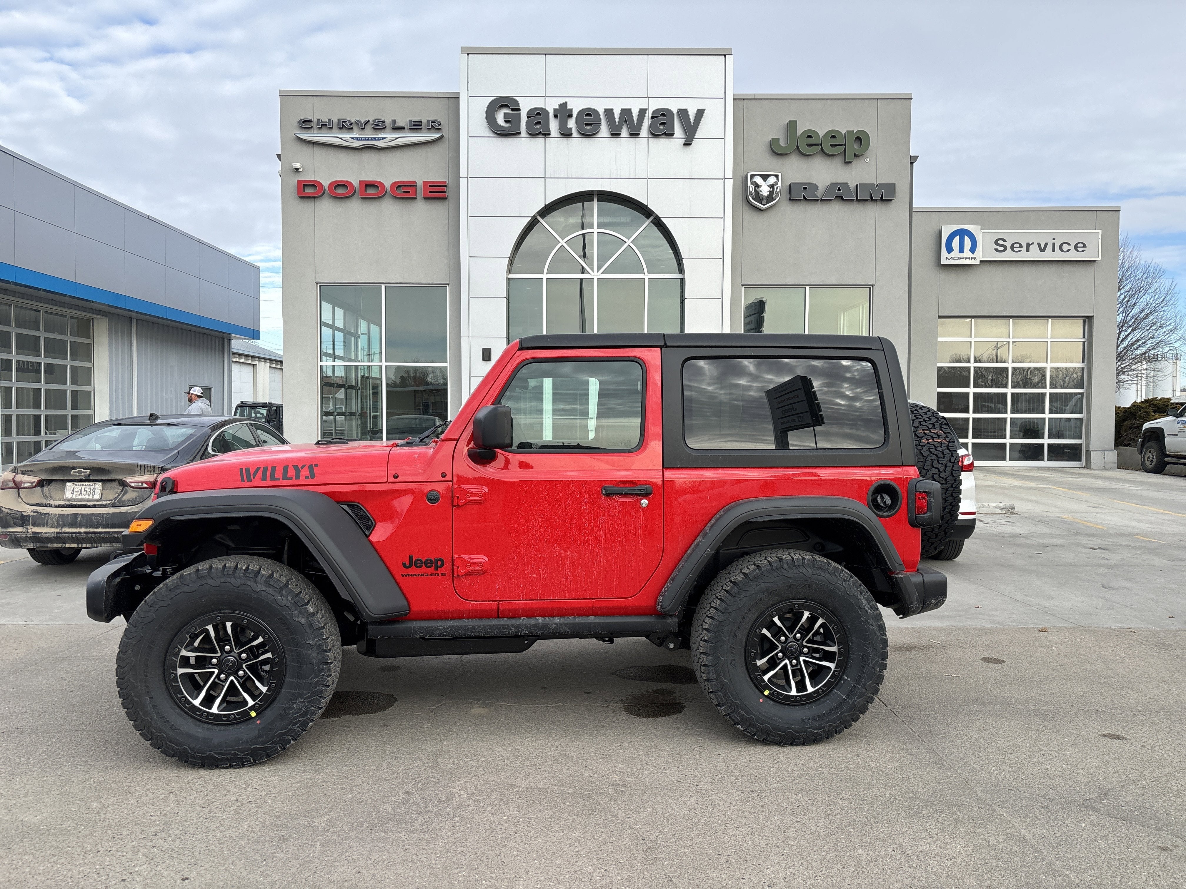 2026 Jeep Wrangler WRANGLER 2-DOOR WILLYS in Firecracker Red Clear-Coat Exterior Paint — front three-quarter view