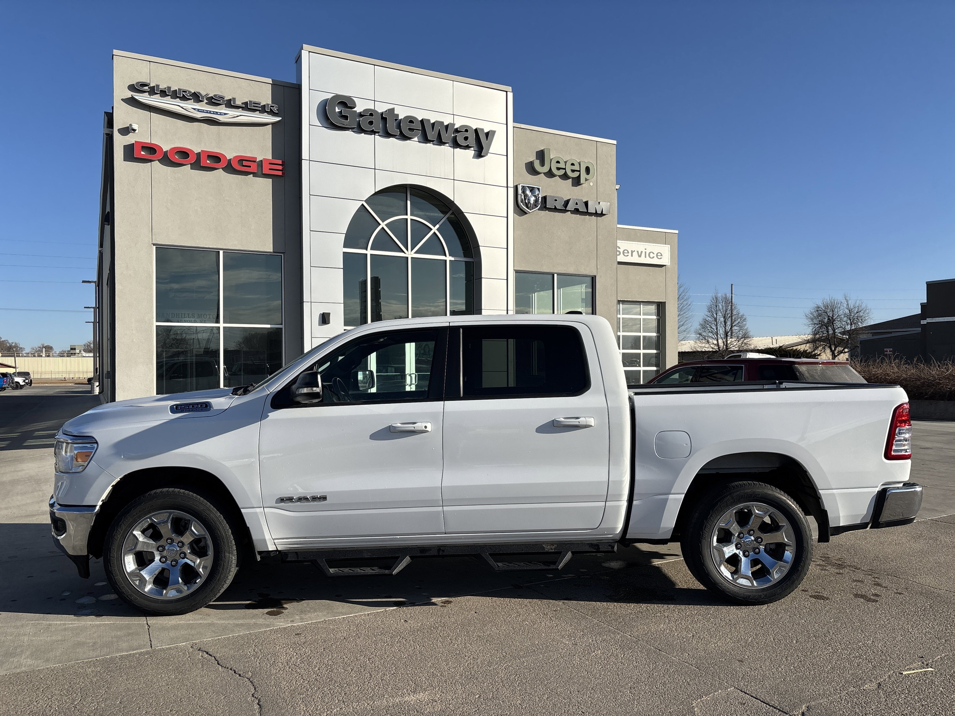 2022 RAM 1500 Big Horn Crew Cab 4x4 5'7' Box in Bright White Clearcoat — front three-quarter view