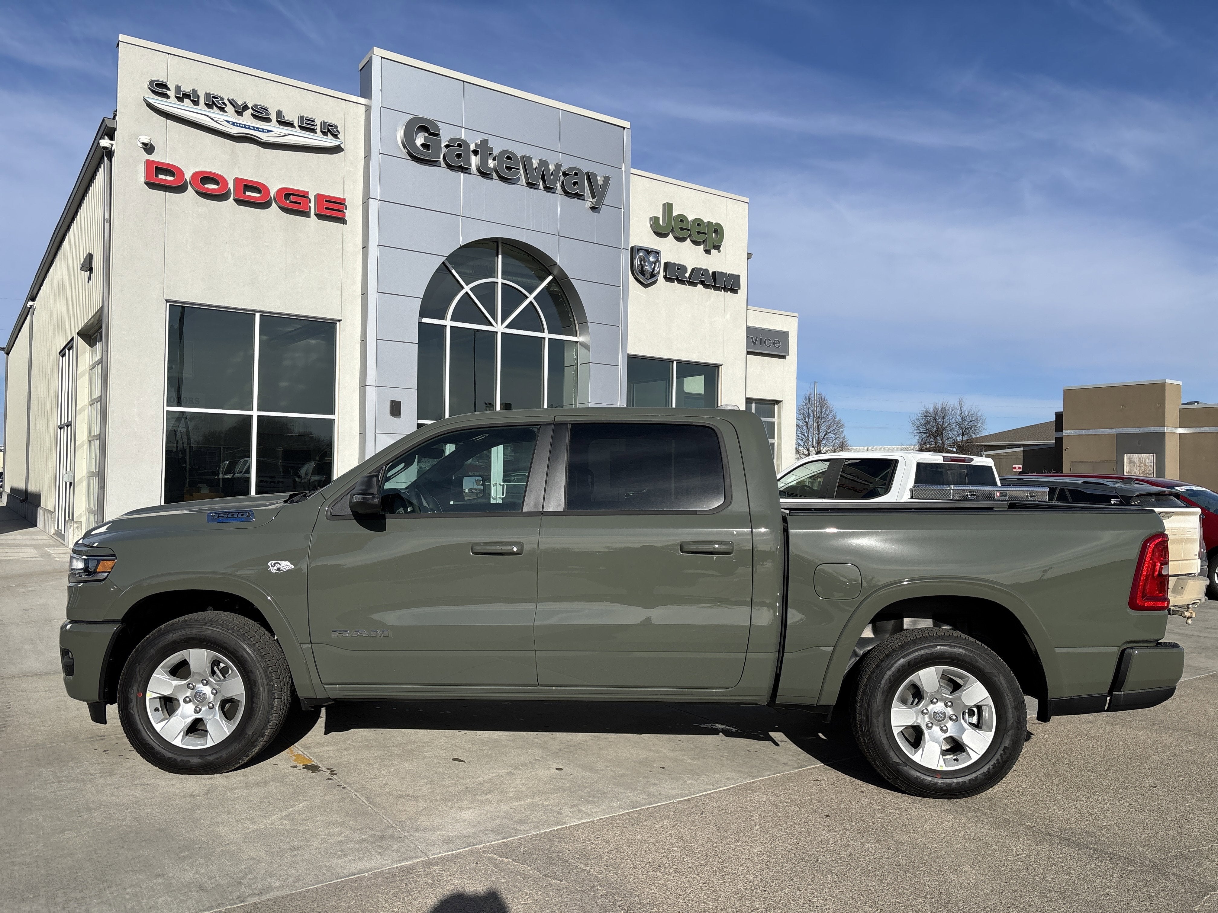 2026 RAM Ram 1500 RAM 1500 BIG HORN CREW CAB 4X4 5'7' BOX in Canyon Lake Exterior Paint — front three-quarter view