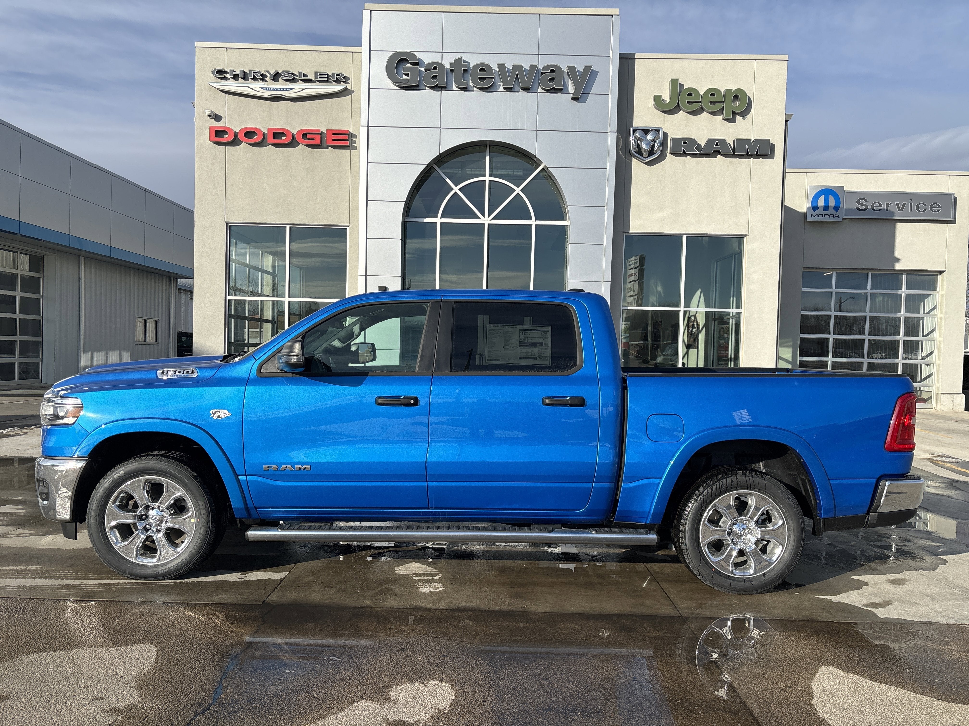 2026 RAM Ram 1500 RAM 1500 BIG HORN CREW CAB 4X4 5'7' BOX in Hydro Blue Pearl-Coat Exterior Paint — front three-quarter view